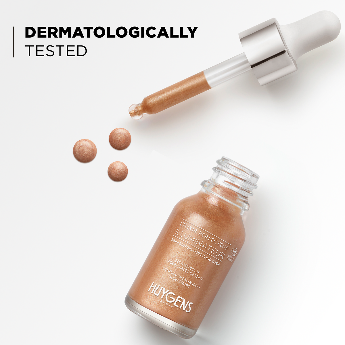 Drops of the elixir and its bottle, dermatologically tested