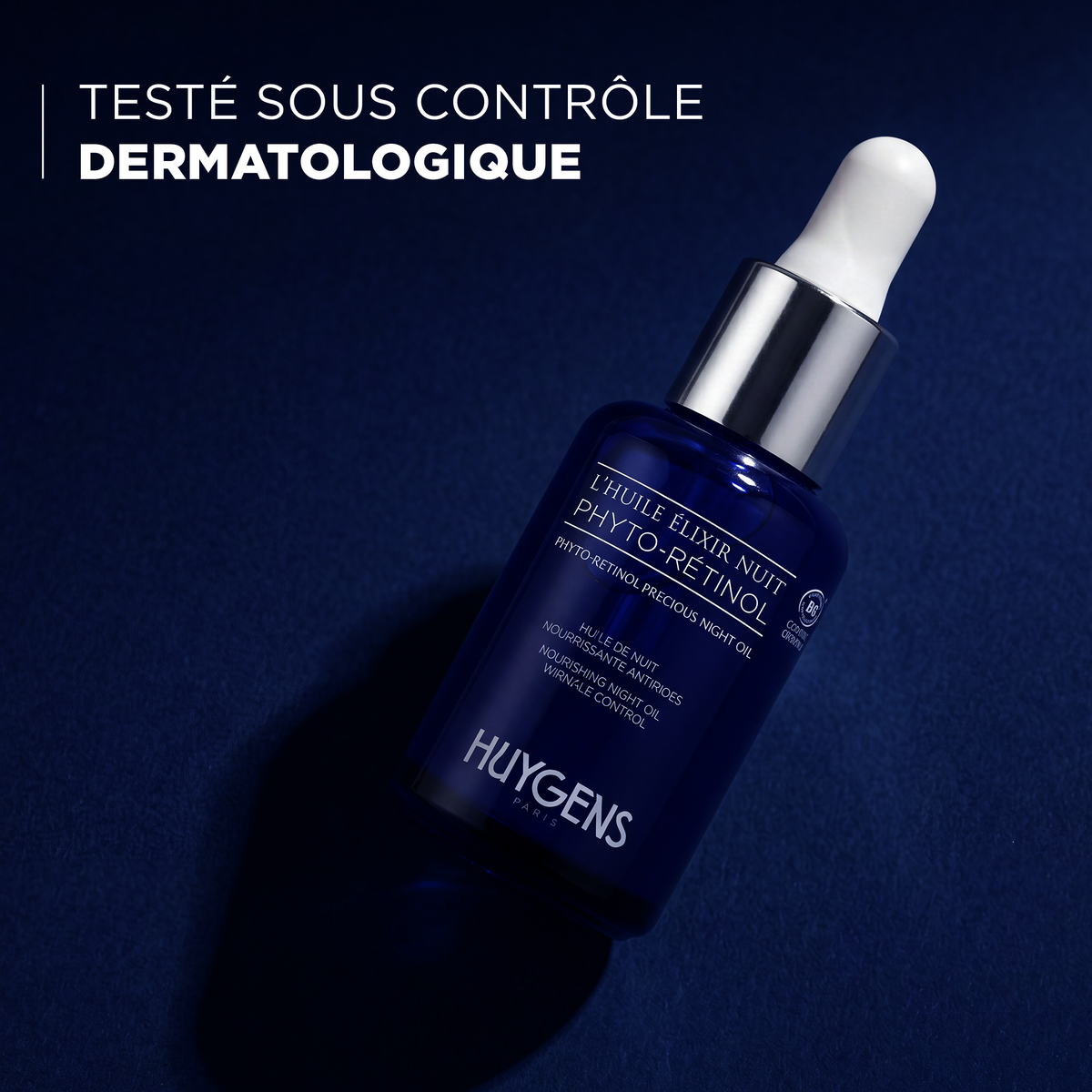 Flacon de l'huile de nuit, testé sous contrôle dermatologique